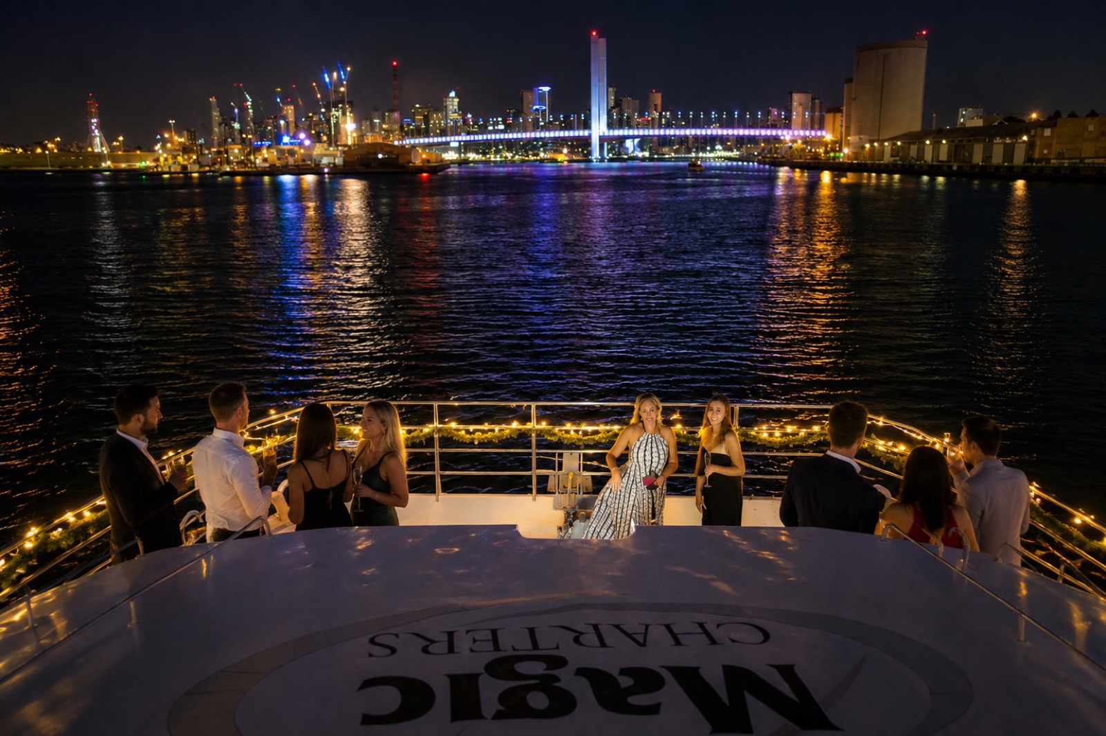 Evening on the front deck of Kingfisher II during a Christmas celebration